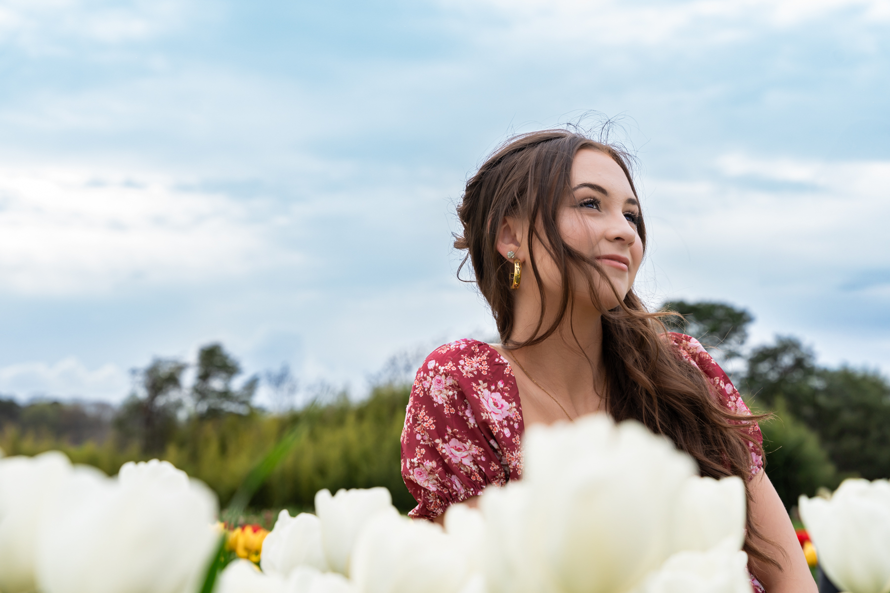 Byrnes high school senior girl poses in tulip field for high school senior photos taken by Taylor Johnson photography at Thompson Family Farms in Campobello South Carolina
