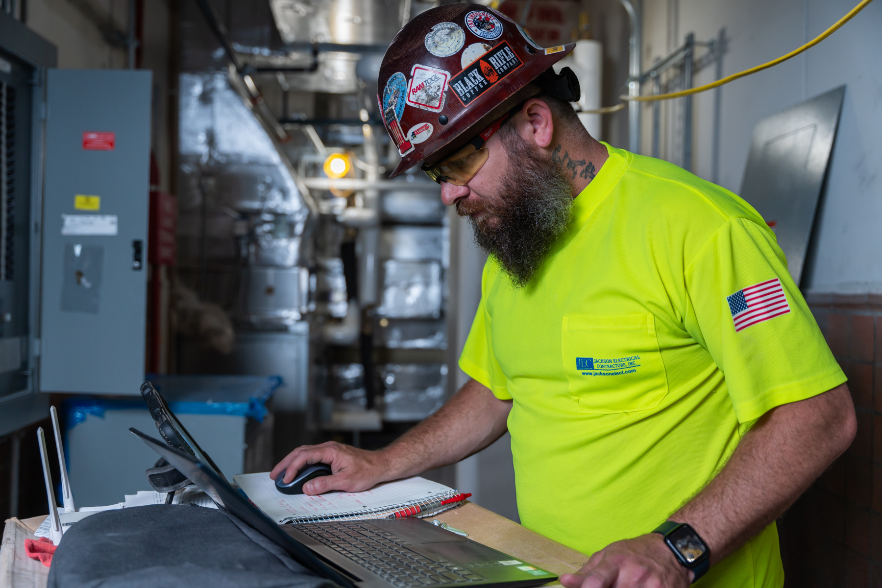 Jackson Electrical general manager going through daily check list on the job site in Black Mountain, NC taken by Taylor Johnson Photography for Comet agency marketing agency.