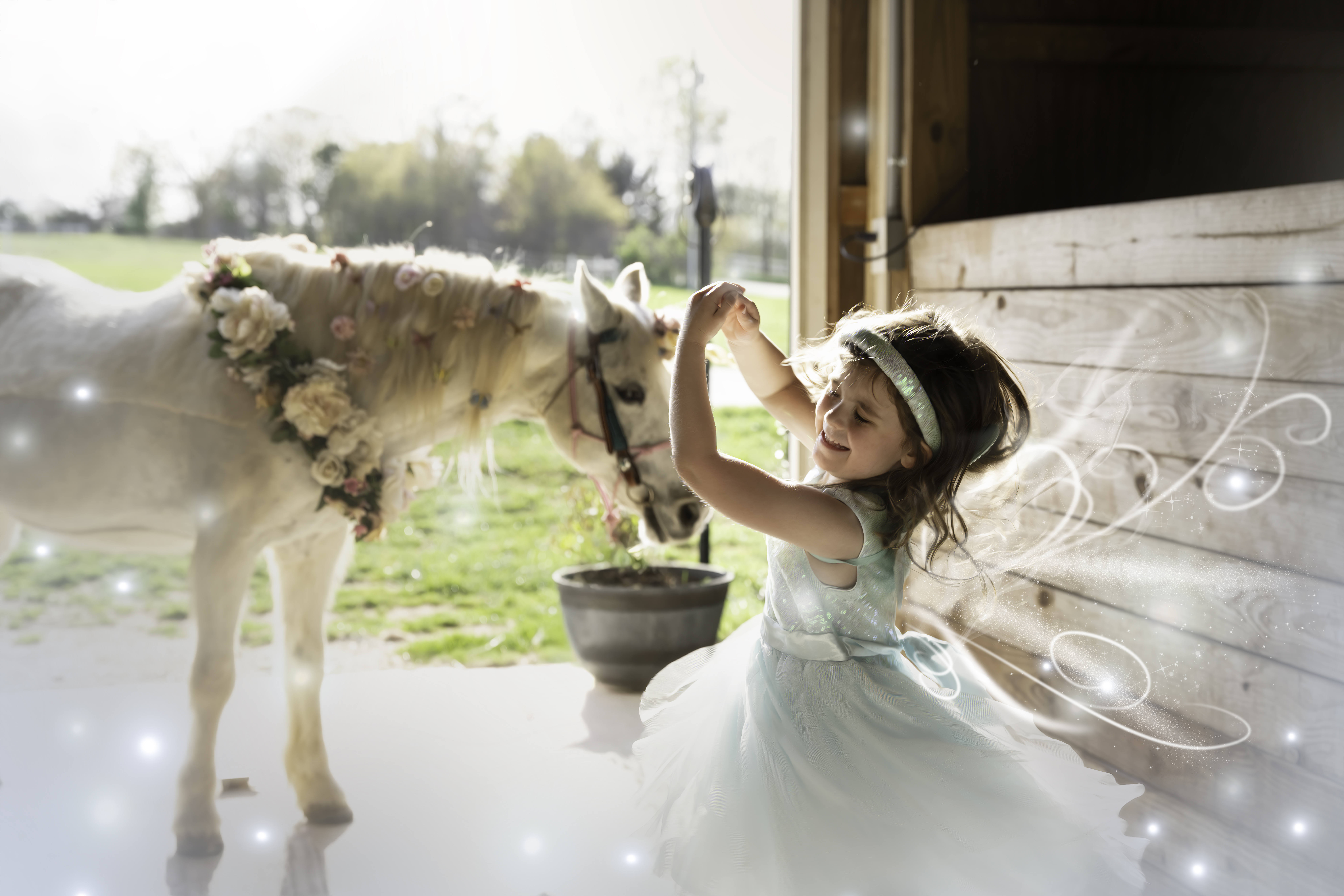 little girl twirls for a photo with a unicorn pony in the background for her fifth birthday photos at sassy stables in Greer, SC taken by Taylor Johnson photography